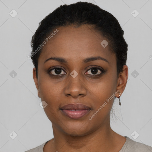 Joyful black young-adult female with short  black hair and brown eyes