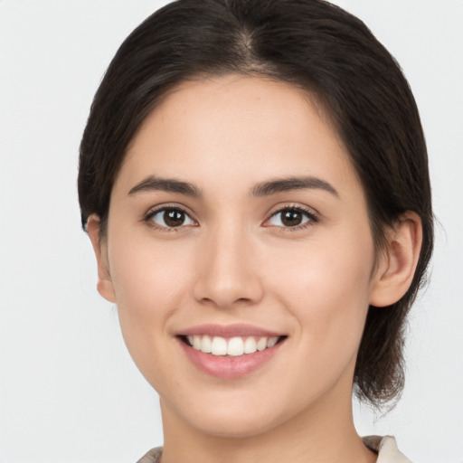 Joyful white young-adult female with medium  brown hair and brown eyes