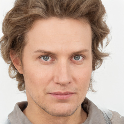 Joyful white adult male with short  brown hair and grey eyes