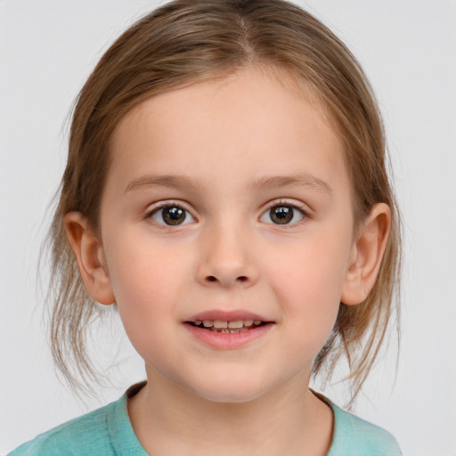 Joyful white child female with medium  brown hair and brown eyes