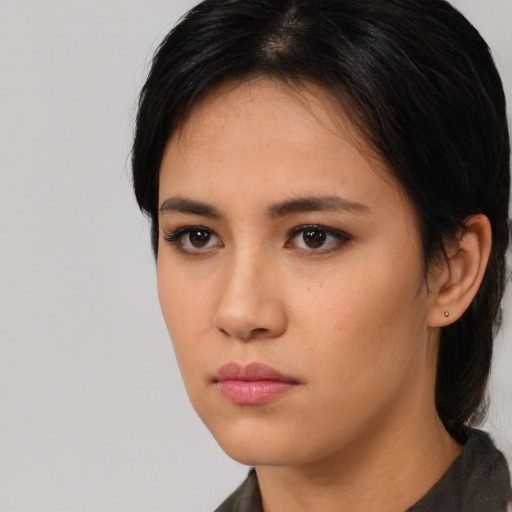Neutral white young-adult female with medium  black hair and brown eyes
