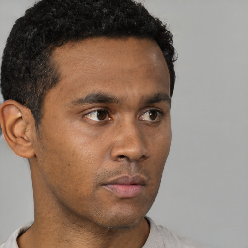 Neutral black young-adult male with short  brown hair and brown eyes