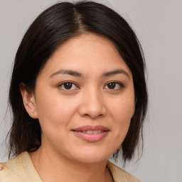 Joyful white young-adult female with medium  brown hair and brown eyes