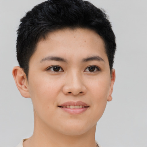 Joyful asian young-adult female with short  brown hair and brown eyes