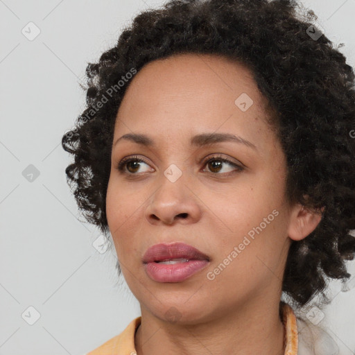 Joyful black young-adult female with medium  black hair and brown eyes