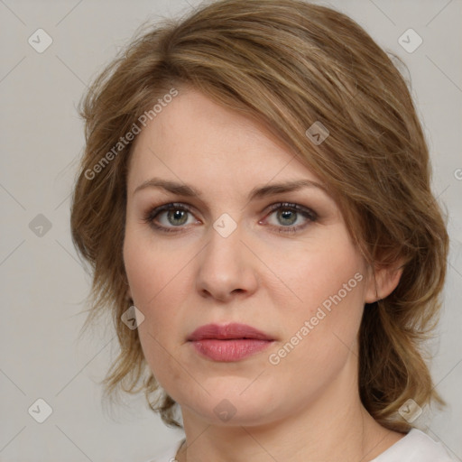 Joyful white young-adult female with medium  brown hair and green eyes