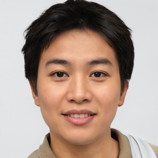 Joyful asian young-adult male with short  brown hair and brown eyes