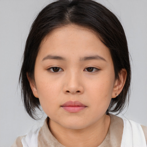 Neutral asian child female with medium  brown hair and brown eyes