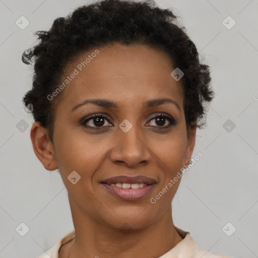 Joyful black young-adult female with short  brown hair and brown eyes