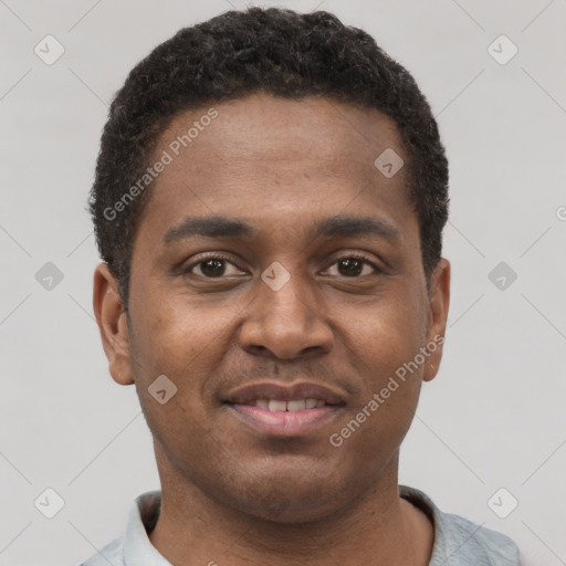 Joyful latino young-adult male with short  brown hair and brown eyes