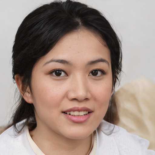 Joyful white young-adult female with medium  brown hair and brown eyes