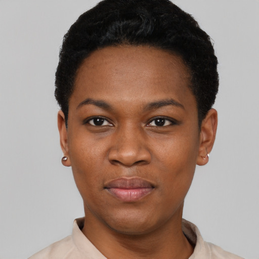 Joyful black young-adult female with short  black hair and brown eyes