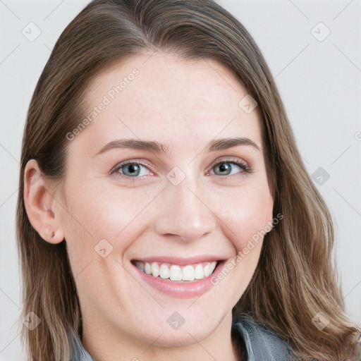 Joyful white young-adult female with long  brown hair and blue eyes