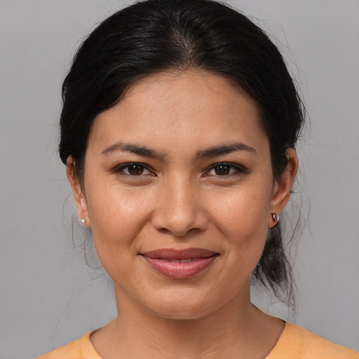 Joyful white young-adult female with medium  brown hair and brown eyes