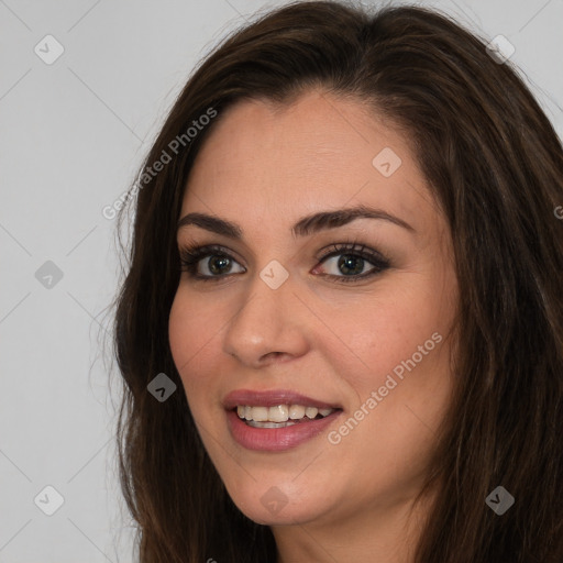 Joyful white young-adult female with long  brown hair and brown eyes