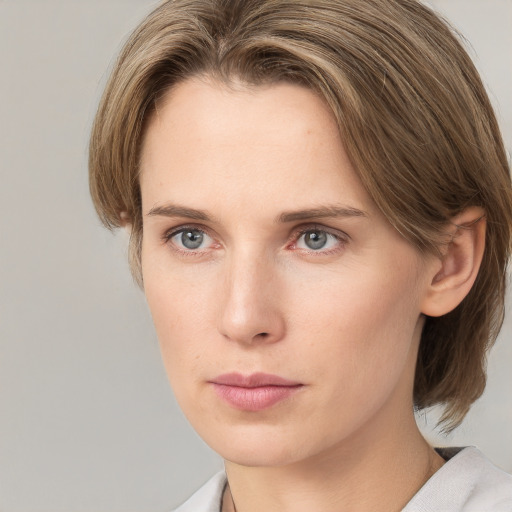 Neutral white young-adult female with medium  brown hair and grey eyes