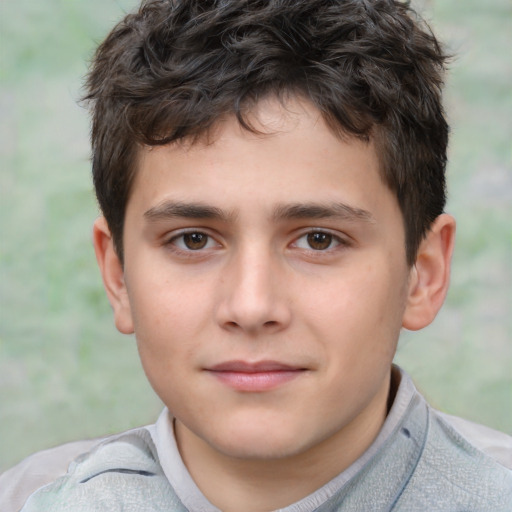 Joyful white child male with short  brown hair and brown eyes