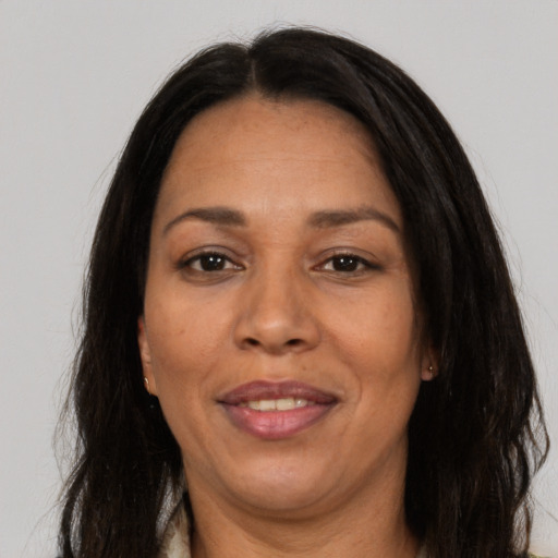 Joyful asian adult female with long  brown hair and brown eyes