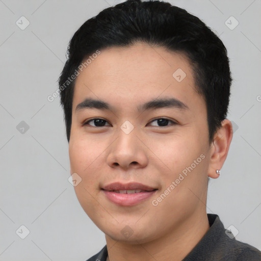 Joyful asian young-adult male with short  black hair and brown eyes