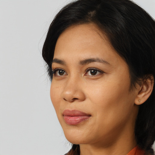 Neutral asian young-adult female with medium  black hair and brown eyes