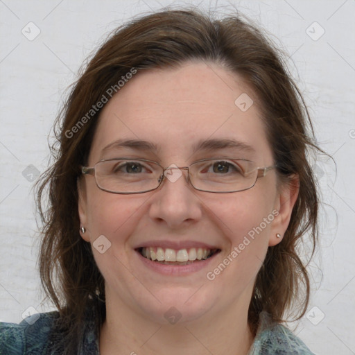 Joyful white adult female with medium  brown hair and blue eyes