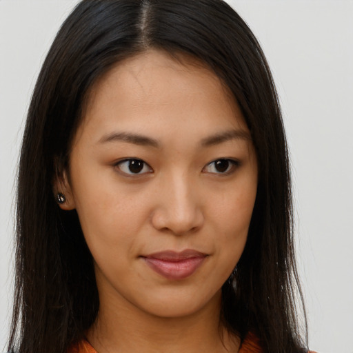 Joyful asian young-adult female with long  brown hair and brown eyes