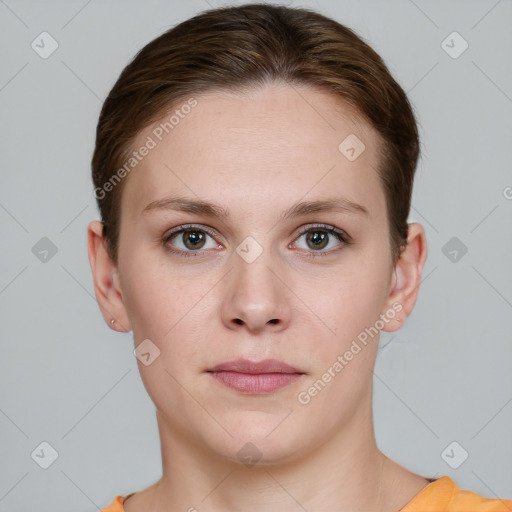 Joyful white young-adult female with short  brown hair and grey eyes