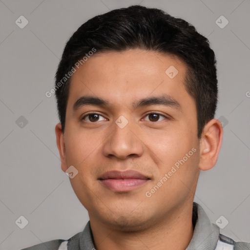 Joyful latino young-adult male with short  black hair and brown eyes