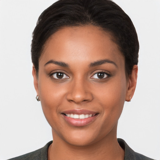 Joyful latino young-adult female with short  brown hair and brown eyes