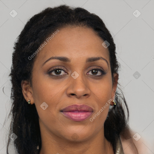 Joyful black adult female with long  brown hair and brown eyes
