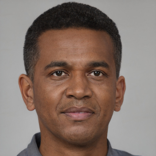 Neutral black adult male with short  brown hair and brown eyes