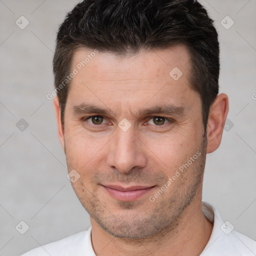 Joyful white adult male with short  brown hair and brown eyes