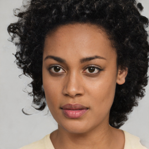 Neutral black young-adult female with medium  black hair and brown eyes
