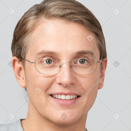 Joyful white adult male with short  brown hair and grey eyes