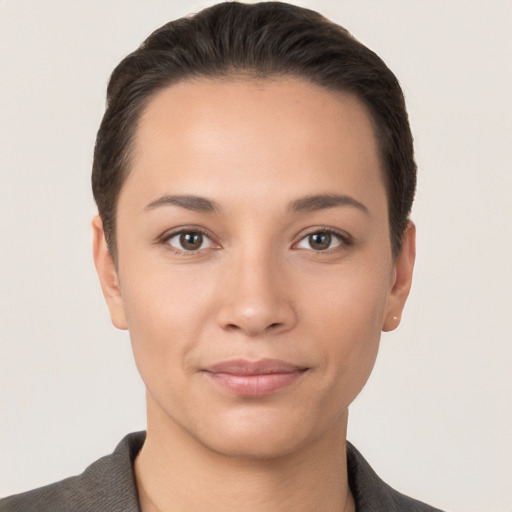 Joyful white young-adult female with short  brown hair and brown eyes