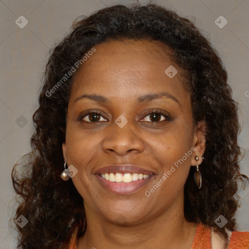 Joyful black young-adult female with medium  brown hair and brown eyes