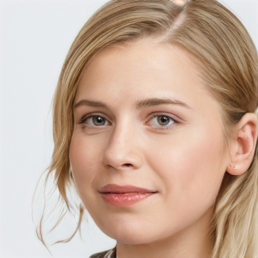 Joyful white young-adult female with long  brown hair and blue eyes