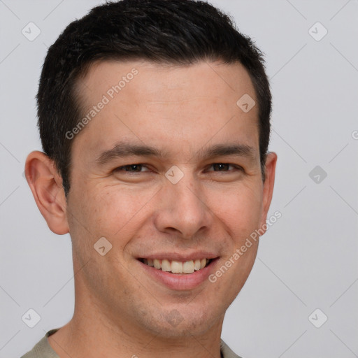 Joyful white young-adult male with short  brown hair and brown eyes