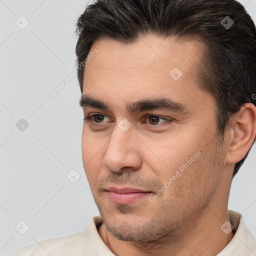 Joyful white young-adult male with short  brown hair and brown eyes