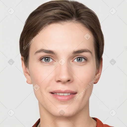 Joyful white young-adult female with short  brown hair and grey eyes