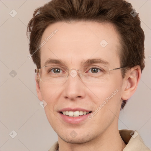 Joyful white adult male with short  brown hair and grey eyes