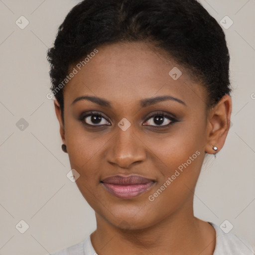 Joyful black young-adult female with short  brown hair and brown eyes