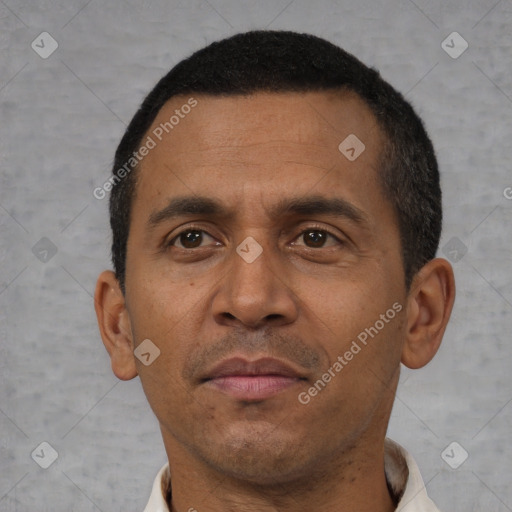 Neutral latino adult male with short  black hair and brown eyes