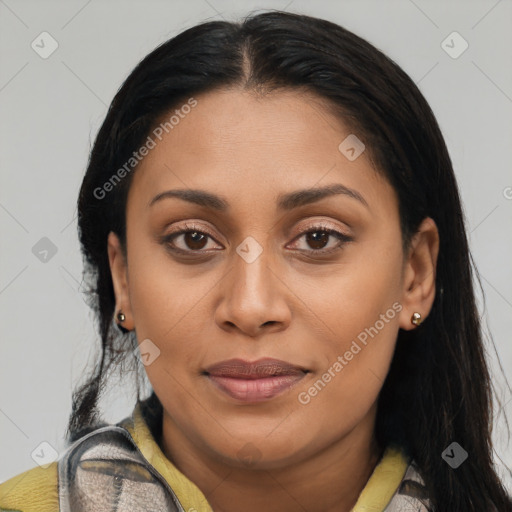 Joyful latino young-adult female with long  brown hair and brown eyes