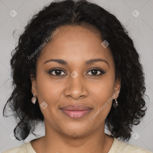 Joyful black young-adult female with long  brown hair and brown eyes