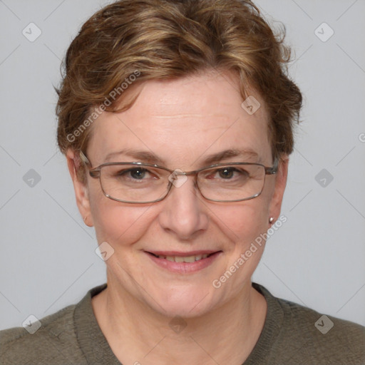 Joyful white adult female with short  brown hair and blue eyes