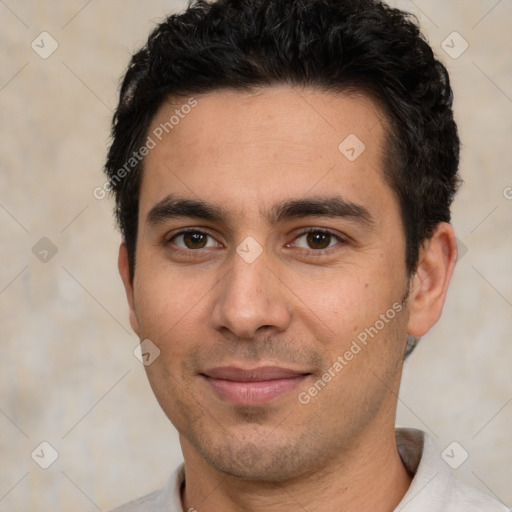 Joyful white young-adult male with short  black hair and brown eyes