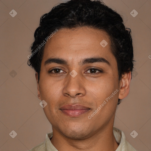 Joyful latino young-adult male with short  black hair and brown eyes