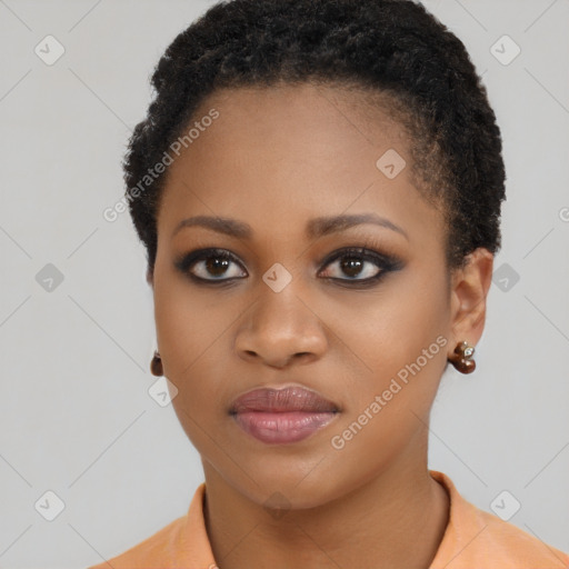 Joyful black young-adult female with short  black hair and brown eyes