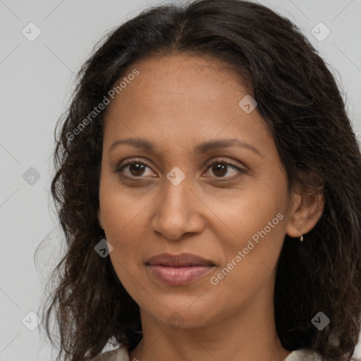 Joyful black adult female with medium  brown hair and brown eyes